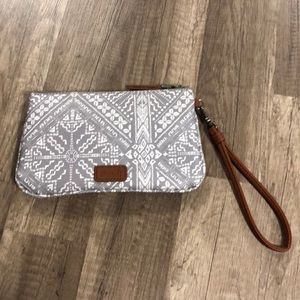 Wristlet with phone charger in side
